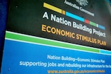 A sign stating that a building project is part of the Rudd Government's economic stimulus