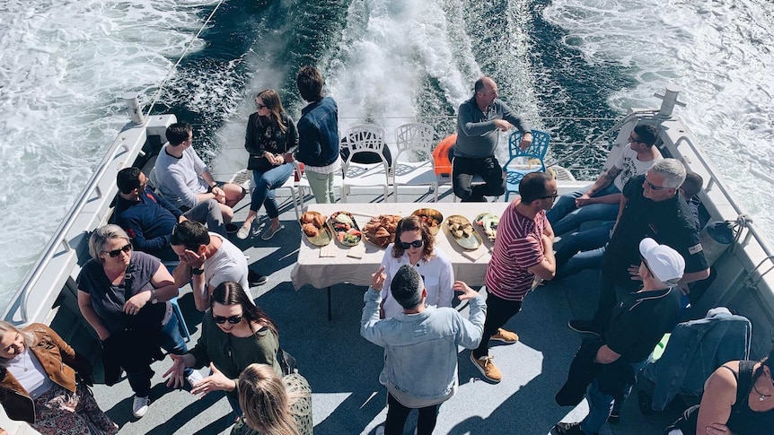 Aerial view of patrons on a boat charter vessel