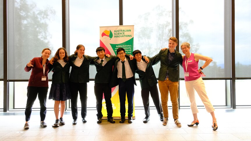 The 2023 International Junior Science Olympiad Team pose wearing their blazers