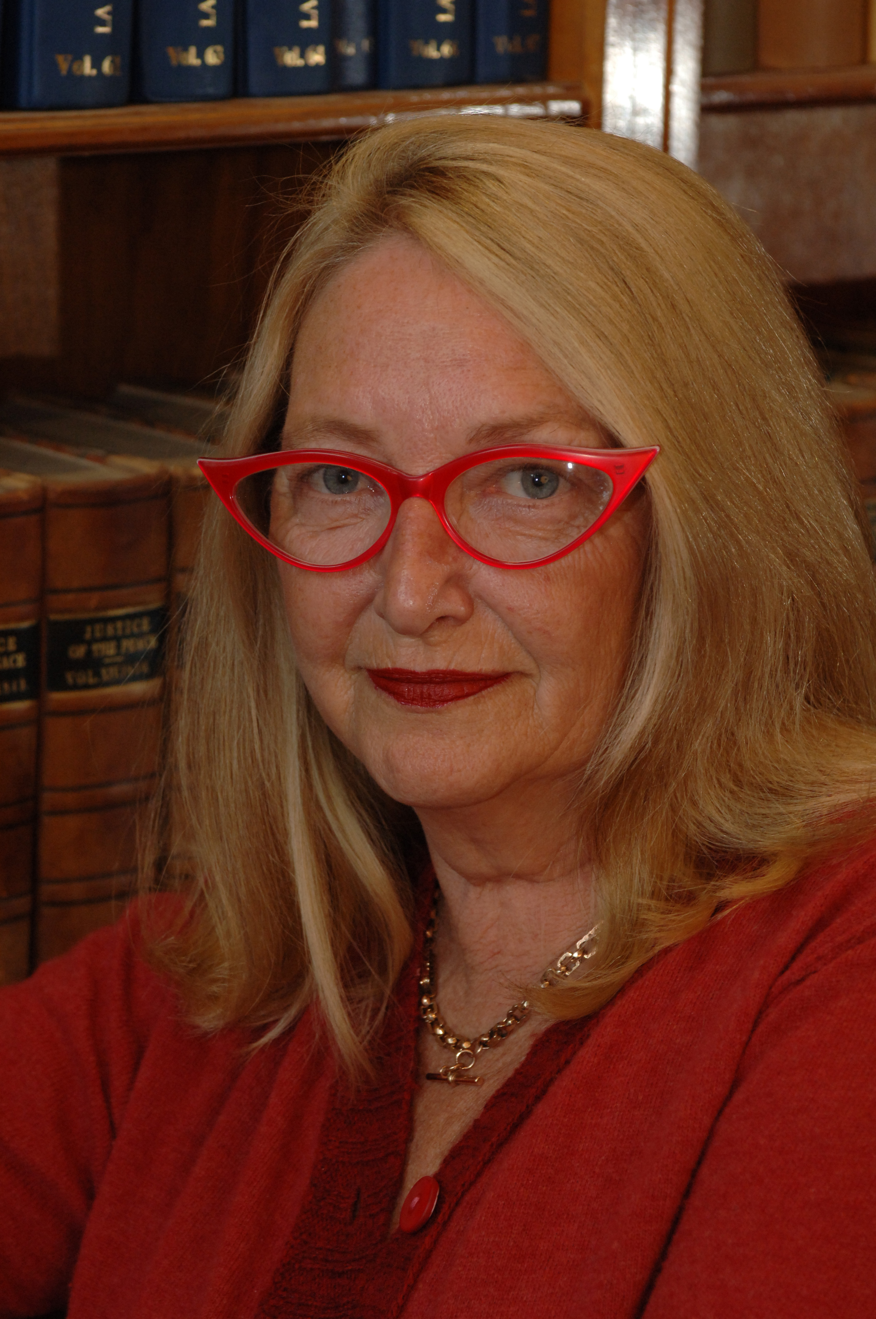 Former Victorian Supreme Court Justice Betty King in front of a book case. 