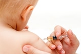 A baby being give a vaccine.