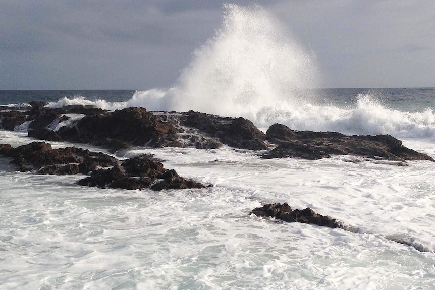 Waves crashing over Snapper Rocks on Queensland's southern Gold Coast.