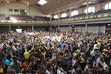 Hawthorn supporters cram into Hobart City Hall to celebrate Grand Final victory