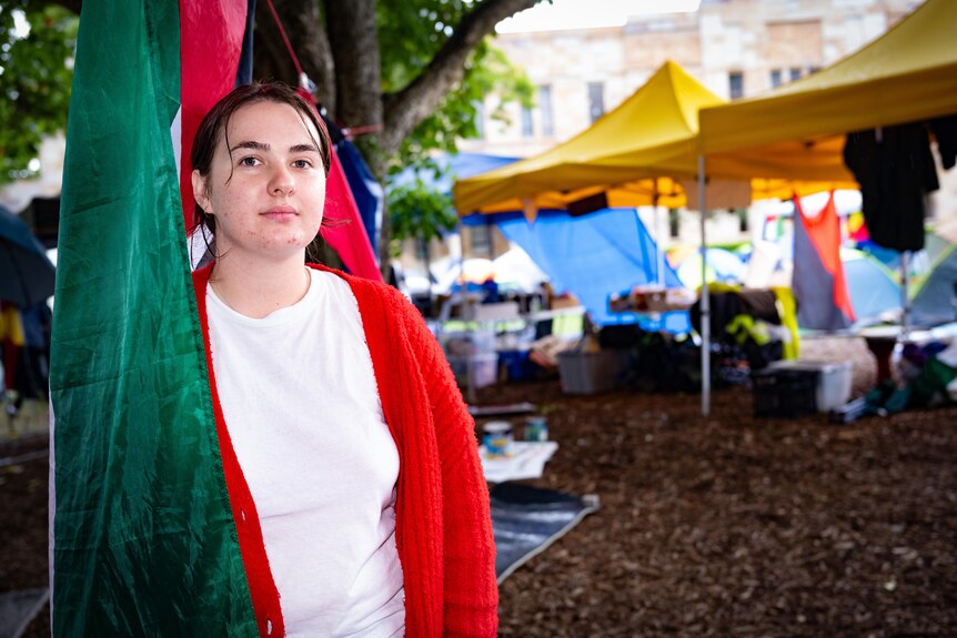 A woman draped in a palestine flag