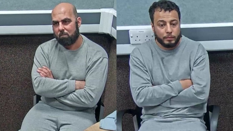 A composite image of two men being interviewed by police, as they sit with crossed arms wearing grey sweatsuits