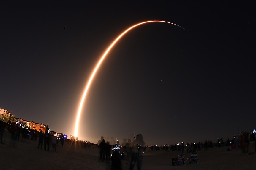 A SpaceX Falcon rocket launches, carrying 60 Starlink satellites