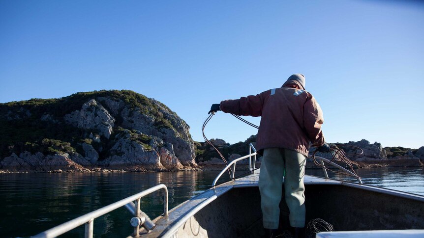 Fisherman Craig Garland on bow of boat