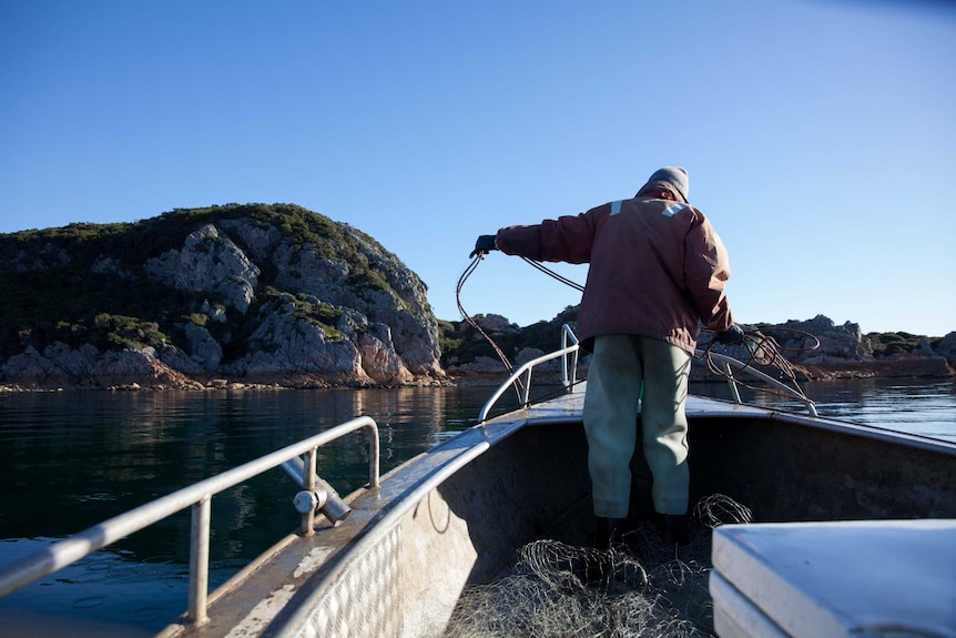 Fisherman Craig Garland on bow of boat