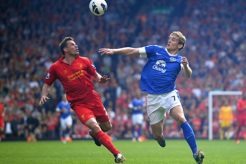 Carragher Jelavic contest for the ball