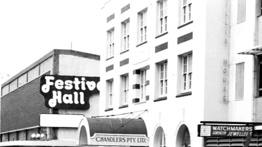 Two men look down Albert Street in the Brisbane CBD during the January 1974 Brisbane floods