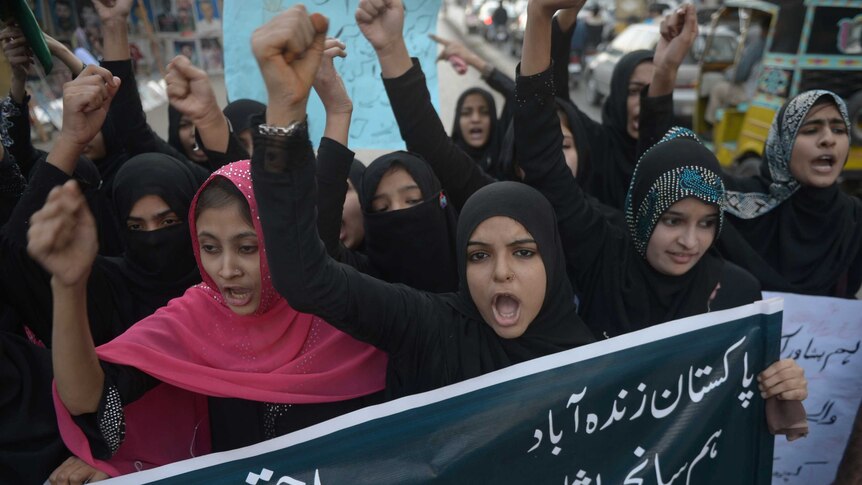 Pakistani students shout anti-Taliban slogans during a protest in Karachi