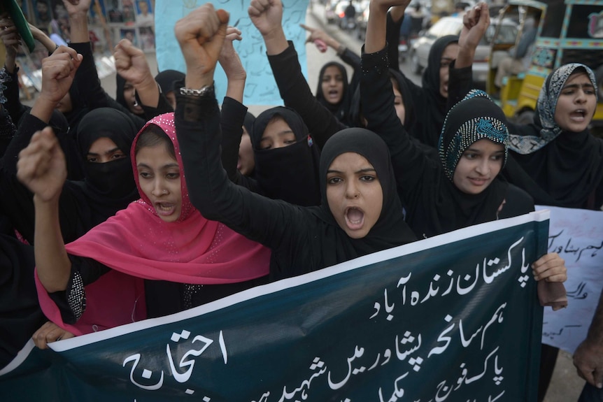 Pakistani students shout anti-Taliban slogans during a protest in Karachi