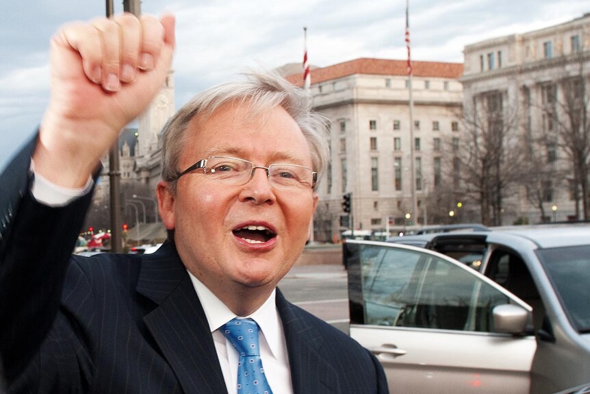 Kevin Rudd leaves for the airport following a press conference in Washington, DC. (AFP: Paul J Richards)