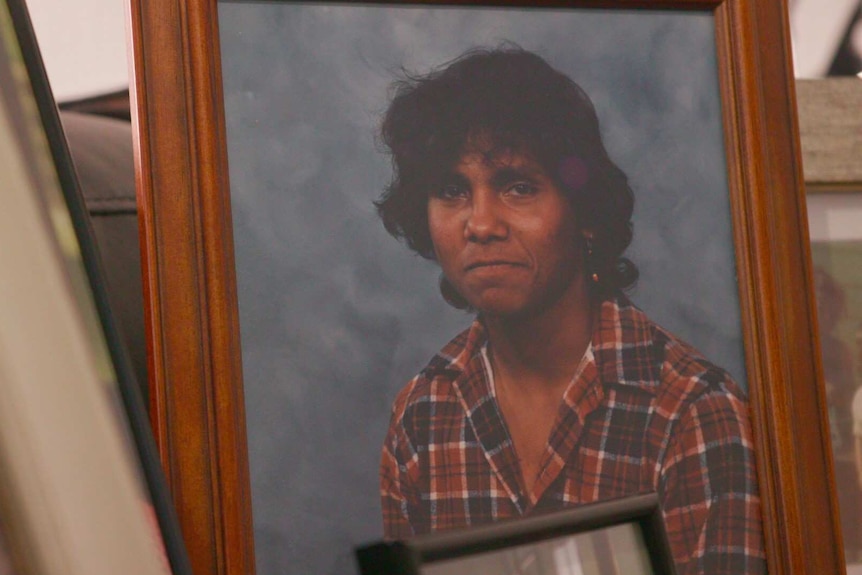 A framed photograph of Aboriginal boy Mark Haines.