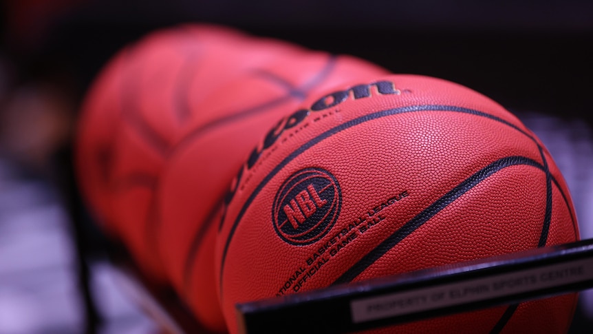 Four basketballs featuring the NBL logo stacked next to each other.