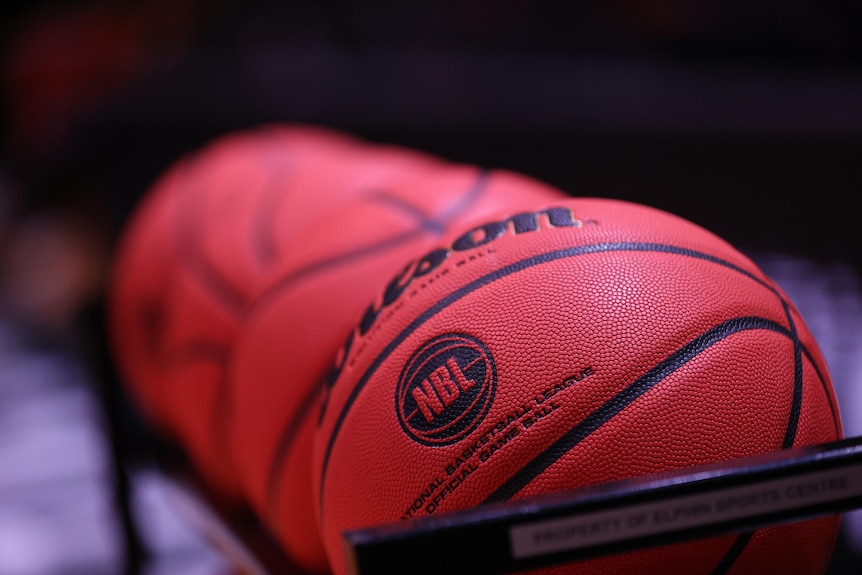 Four basketballs featuring the NBL logo stacked next to each other.