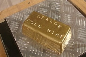 A gold bar stamped with the words Cracow gold mine.