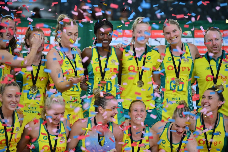 Confetti falls around players from Australia's Diamonds netball team after they won the Quad Series final against New Zealand.