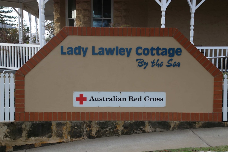 A brick and concrete sign outside the front of Lady Lawley Cottage in Cottesloe.
