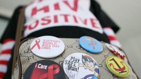 A HIV-infected woman with World AIDS day badges (AFP: Ahmad Zamroni)