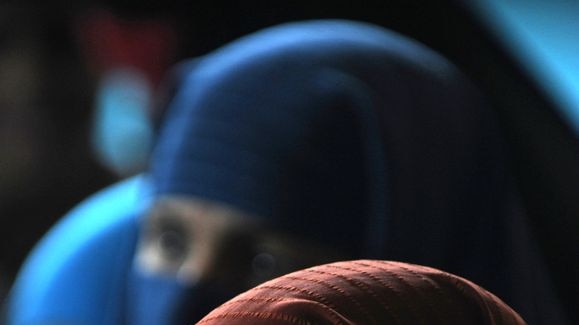 Women listen at a mosque