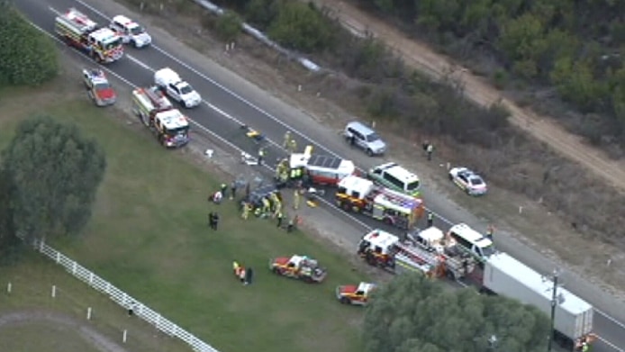 An aerial image of a crash between a car and a minibus with emergency services on the scene.