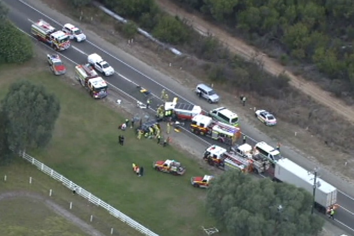 An aerial image of a crash between a car and a minibus with emergency services on the scene.