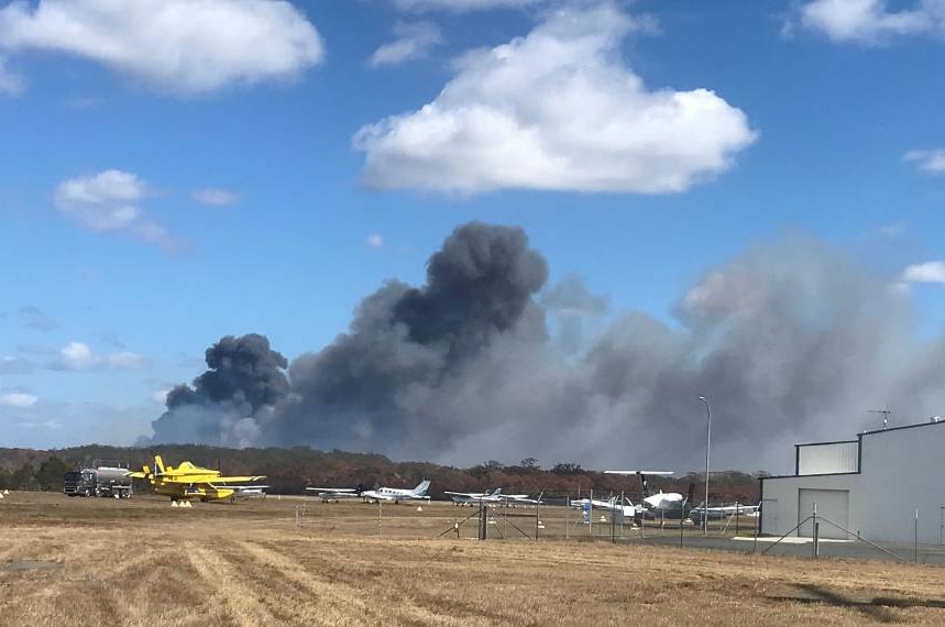 The fire near Port Macquarie Airport burning in wetland