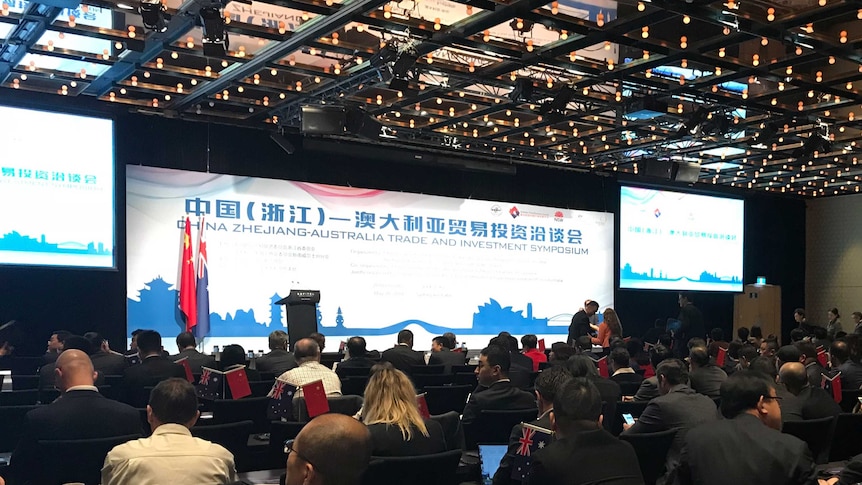 A delegation of Chinese and Australian business people seated at an investment event held in Sydney in May 2018.