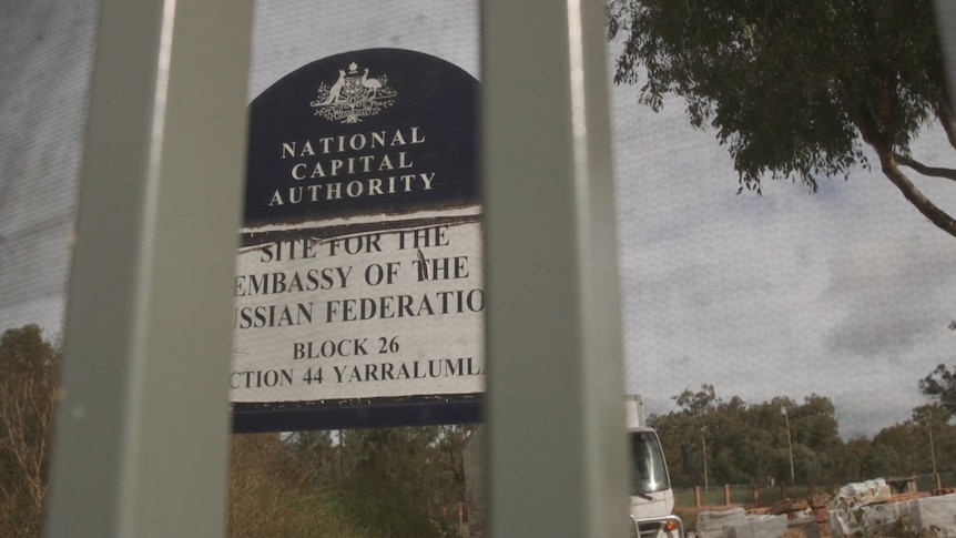 A National Capital Authority blue sign on a building site marking the planned future location for a Russian Embassy.