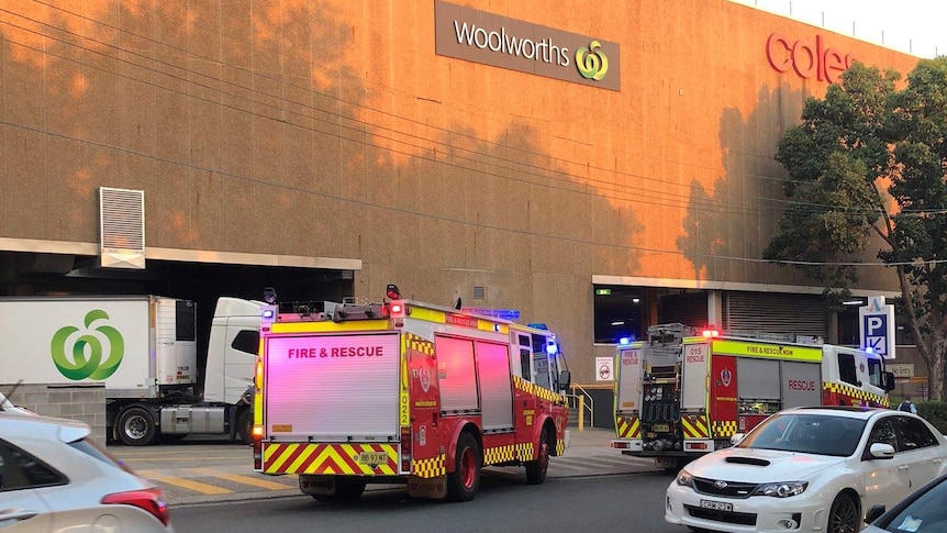Fire trucks outside a shopping centre in the afternoon