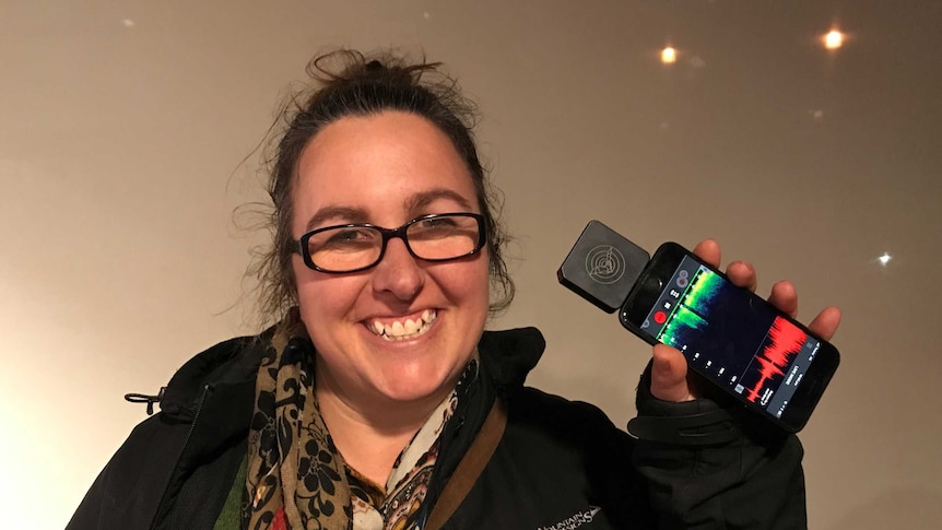 Tasmanian Bat expert Dr Lisa Cawthen holding a bat detector