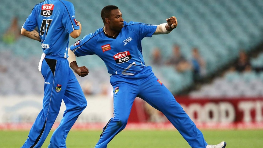 Kieron Pollard (R) of the Strikers celebrates taking the wicket of the Thunder's Chris Gayle.