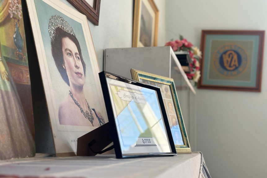 A portrait of Queen Elizabeth stands atop a piano in the CWA halls. 