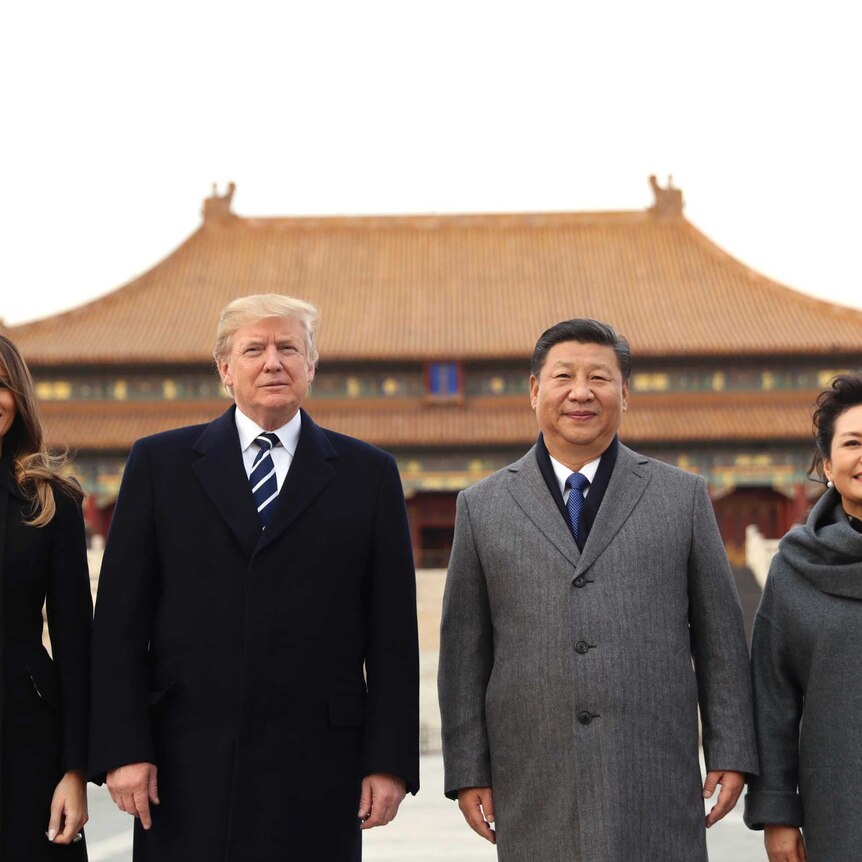 Donald Trump, Melania Trump, Xi Jinping and Peng Liyuan stand in front of a Forbidden City palace.