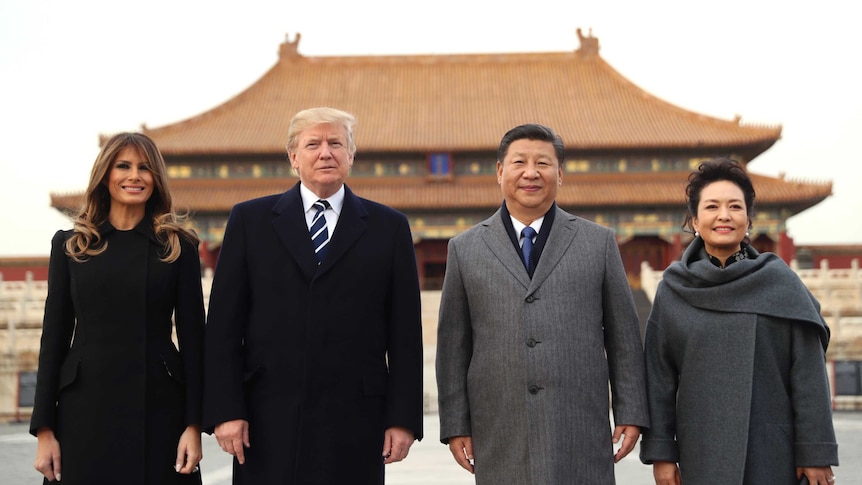 Donald Trump, Melania Trump, Xi Jinping and Peng Liyuan stand in front of a Forbidden City palace.