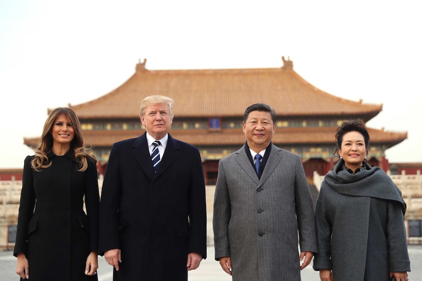 Donald Trump, Melania Trump, Xi Jinping and Peng Liyuan stand in front of a Forbidden City palace.