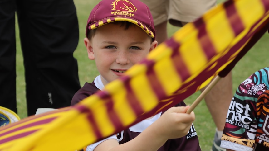 Young Broncos fan waves flag