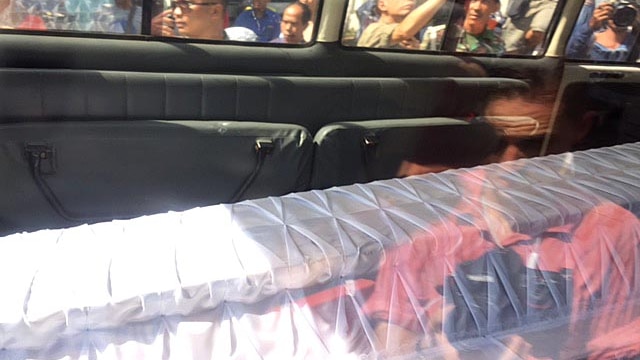 Coffins in back of ambulance