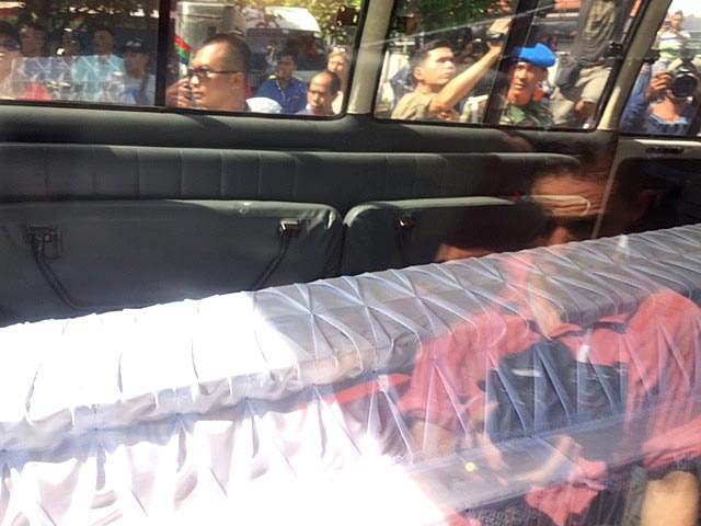 Coffins in back of ambulance