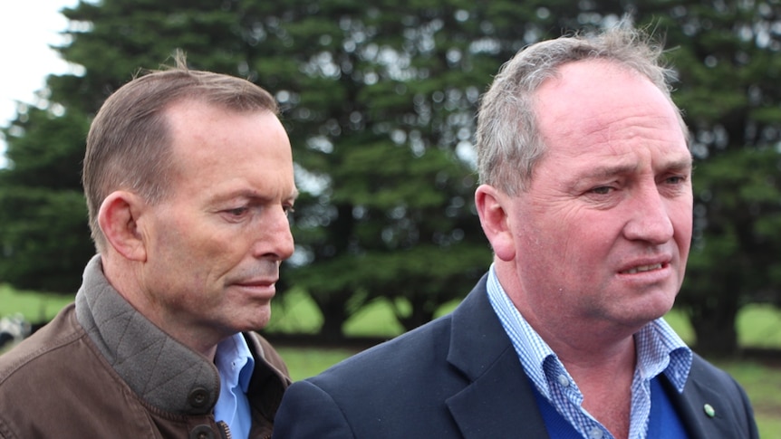Prime Minister Tony Abbott and Agriculture Minister Barnaby Joyce on a dairy farm