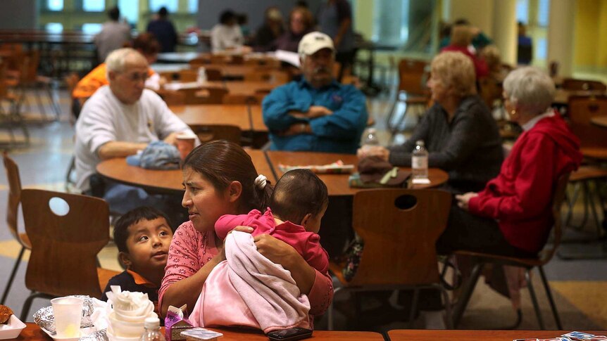 People shelter from Hurricane Sandy in an evacuation centre
