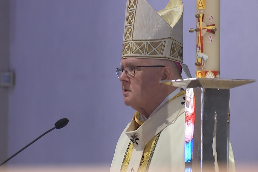 Archbishop of Brisbane Mark Coleridge speaking into a microphone