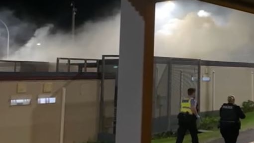 Smoke billows from rooftops at Yongah Hill detention centre