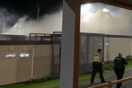 Smoke billows from rooftops at Yongah Hill detention centre