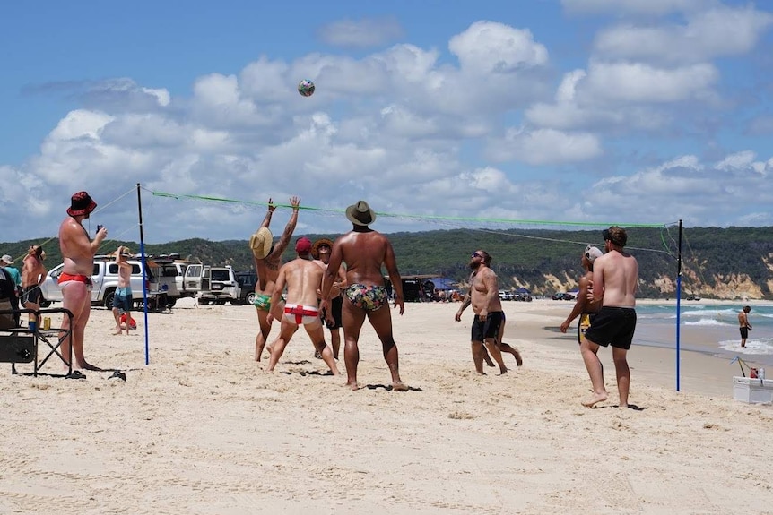 School leavers play volleyball at Teewah Beach on Queensland's Sunshine Coast with friends.