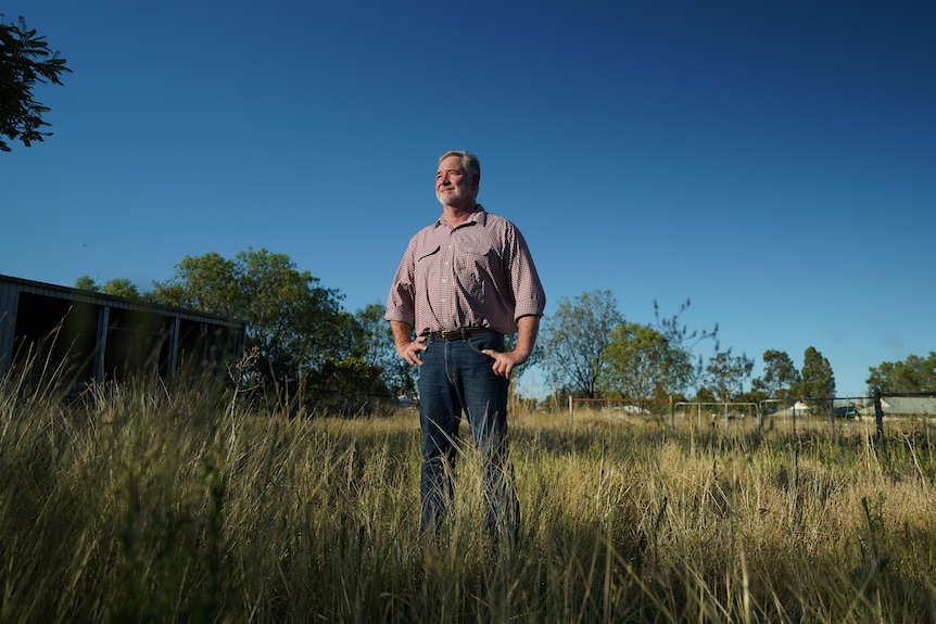 A man stands in a field