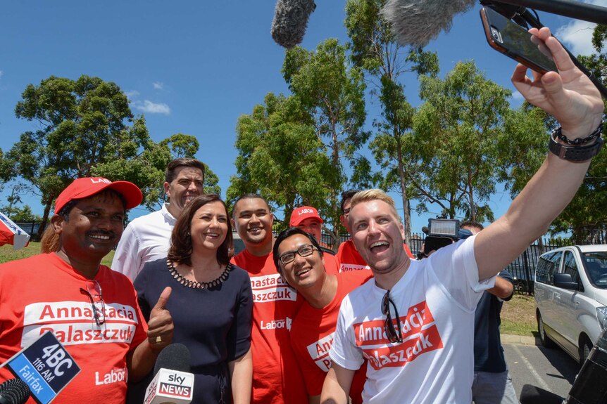 Ms Palaszczuk poses for a selfie with Labor Party volunteers.