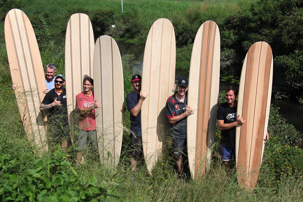 shaping a wooden surfboard