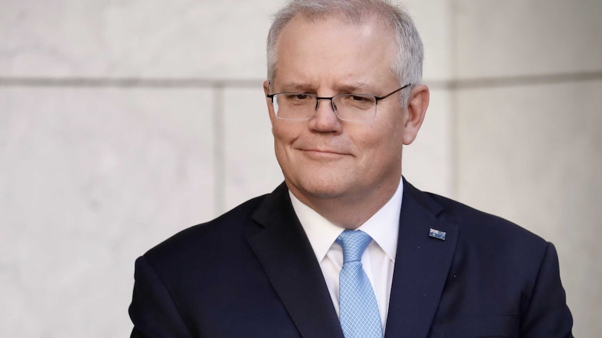 Scott Morrison in blue tie with a small grin